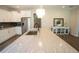 Bright kitchen featuring a large island with a granite countertop and stainless steel appliances at 337 Paynes Lake Rd, Carrollton, GA 30116