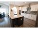 Open kitchen featuring island seating, stylish pendant lighting, and stainless steel appliances at 337 Paynes Lake Rd, Carrollton, GA 30116