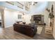 Open living room with vaulted ceilings, fireplace, hardwood floors, and loft at 337 Paynes Lake Rd, Carrollton, GA 30116