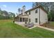 Relax on the back patio with two lounge chairs and a screened in porch area at 337 Paynes Lake Rd, Carrollton, GA 30116