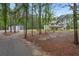 A large property with a two-story home, steel building, and ample wooded acreage at 337 Paynes Lake Rd, Carrollton, GA 30116