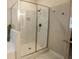 Modern shower enclosure features elegant tilework, built-in shelving, and sleek hardware, enhancing the bathroom's appeal at 337 Paynes Lake Rd, Carrollton, GA 30116