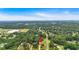 Aerial view of the home surrounded by lush green trees and landscaping at 17 River Walk Pkwy, Euharlee, GA 30145
