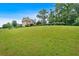 Large open backyard with a view of the home at 17 River Walk Pkwy, Euharlee, GA 30145
