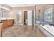 Bathroom with double sink vanity, walk in shower and a soaking tub at 17 River Walk Pkwy, Euharlee, GA 30145