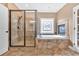 Bathroom showcasing a glass-enclosed shower, soaking tub and a fireplace at 17 River Walk Pkwy, Euharlee, GA 30145