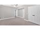 Spacious bedroom with wood-look flooring, large closet, neutral paint, and fan at 17 River Walk Pkwy, Euharlee, GA 30145