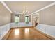 Formal dining room with hardwood floors, elegant wainscoting, and ample natural light at 17 River Walk Pkwy, Euharlee, GA 30145