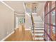 Elegant foyer with hardwood floors, a grand staircase, and plenty of natural light at 17 River Walk Pkwy, Euharlee, GA 30145