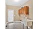 Functional laundry room features built in storage and a utility sink at 17 River Walk Pkwy, Euharlee, GA 30145