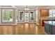 Spacious living room with hardwood floors and bright windows leading to an outdoor space at 17 River Walk Pkwy, Euharlee, GA 30145