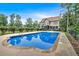 Backyard view of the private in-ground swimming pool and home exterior at 17 River Walk Pkwy, Euharlee, GA 30145