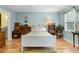 Comfortable bedroom with hardwood floors and soft, pastel blue walls and bright light at 2779 Bentley Se Pl, Marietta, GA 30067