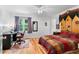 Well-lit bedroom featuring a desk, hardwood floors, and unique celestial themed decor at 2779 Bentley Se Pl, Marietta, GA 30067