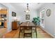 Charming dining room featuring wood floors, a light fixture and an area rug at 2779 Bentley Se Pl, Marietta, GA 30067