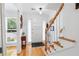 Bright entryway featuring a staircase, wood floors, white walls, and an inviting front door with a window at 2779 Bentley Se Pl, Marietta, GA 30067