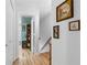 Hallway with hardwood floors leading to an organized living space with built-in shelving at 2779 Bentley Se Pl, Marietta, GA 30067