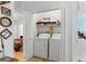 Convenient laundry closet with a washer and dryer, located off the bedroom at 2779 Bentley Se Pl, Marietta, GA 30067