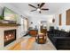 Spacious living room with hardwood floors, a fireplace, and ample seating at 2779 Bentley Se Pl, Marietta, GA 30067