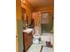 Cozy bathroom featuring a floral shower curtain, single vanity, and natural light from the window at 2800 Browntown Nw Rd, Atlanta, GA 30318