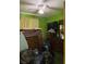 Green bedroom with an area to put clothes and dresser at 2800 Browntown Nw Rd, Atlanta, GA 30318