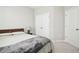 Simple bedroom featuring soft carpet, a closet, and natural light at 3313 Park Pointe Cir, Scottdale, GA 30079