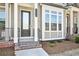 The well-maintained townhome showcases brick steps and a decorative porch at 3313 Park Pointe Cir, Scottdale, GA 30079