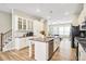 Modern kitchen boasting white cabinets, granite countertops, and stainless steel appliances at 3313 Park Pointe Cir, Scottdale, GA 30079