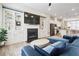 Open floor plan living room with a fireplace, built-in shelving, and kitchen view at 3313 Park Pointe Cir, Scottdale, GA 30079
