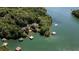 Stunning aerial view of waterfront homes nestled among lush trees with private docks at 7815 Bamby Rd, Cumming, GA 30041