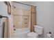 Bathroom with a combination tub and shower and tile surround at 7815 Bamby Rd, Cumming, GA 30041