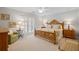 Bedroom with a beautiful wood bed frame, neutral walls, and carpeted floors at 7815 Bamby Rd, Cumming, GA 30041
