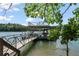 Lake view of boat dock equipped with lifts, offering convenient access to water activities at 7815 Bamby Rd, Cumming, GA 30041