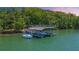 Modern boat dock with multiple boat slips, showcasing waterfront living and easy access to the lake at 7815 Bamby Rd, Cumming, GA 30041