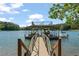 Well-maintained boat dock with lifts provides convenient boat storage and lake access for recreational activities at 7815 Bamby Rd, Cumming, GA 30041