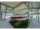 Covered boat dock with a boat lift offers easy access to the water for boating and water sports at 7815 Bamby Rd, Cumming, GA 30041