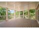 Spacious covered porch is perfect for outdoor activities and enjoying the surrounding scenery at 7815 Bamby Rd, Cumming, GA 30041