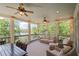 Comfortable covered porch with peaceful lake views provides great space for outdoor relaxation at 7815 Bamby Rd, Cumming, GA 30041