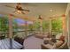 Enjoy evening sunsets from this comfortable covered porch overlooking the lake at 7815 Bamby Rd, Cumming, GA 30041