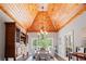 Dining room with a vaulted wood ceiling, hardwood floors, and a large window with great natural light at 7815 Bamby Rd, Cumming, GA 30041