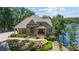Charming stone and shake home with manicured landscaping and lake view at 7815 Bamby Rd, Cumming, GA 30041