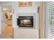 Cozy fireplace with detailed mantle between bathroom and main bedroom at 7815 Bamby Rd, Cumming, GA 30041