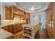 Gourmet kitchen featuring an island, wood cabinets, granite counters, and stainless appliances at 7815 Bamby Rd, Cumming, GA 30041