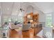 Bright living room with vaulted ceilings, a stone fireplace, hardwood floors, and lots of natural light at 7815 Bamby Rd, Cumming, GA 30041