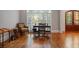 Cozy music room with a piano, a desk and elegant hardwood floors, perfect for relaxation and entertainment at 7815 Bamby Rd, Cumming, GA 30041