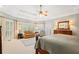 Bright main bedroom with cozy seating area, large windows, and elegant decor for relaxation at 7815 Bamby Rd, Cumming, GA 30041