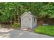 Charming shed with painted siding and stone steps at 7815 Bamby Rd, Cumming, GA 30041