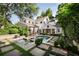 Gorgeous backyard featuring a sparkling pool, well-manicured lawn, and mature trees at 820 Highland Ne Ter, Atlanta, GA 30306