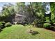 Lush backyard featuring well-maintained landscaping and a charming shed or outbuilding at 820 Highland Ne Ter, Atlanta, GA 30306