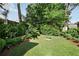 Lush backyard with green lawn and dense landscaping, perfect for privacy at 820 Highland Ne Ter, Atlanta, GA 30306